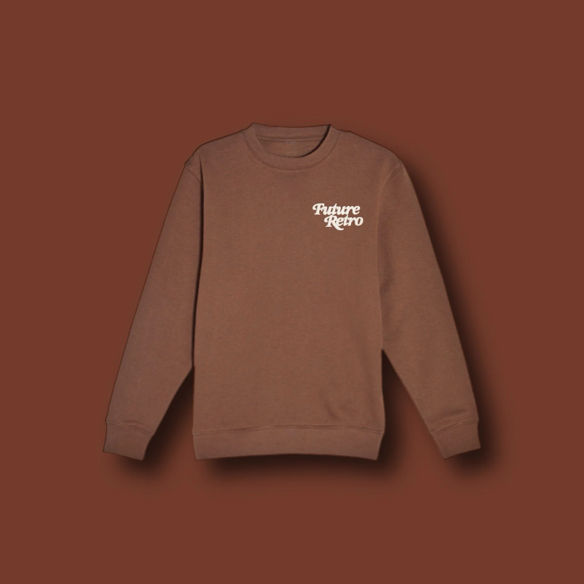 Brown sweatshirt with white text that reads 'Future Retro' on the chest, against a matching brown background.