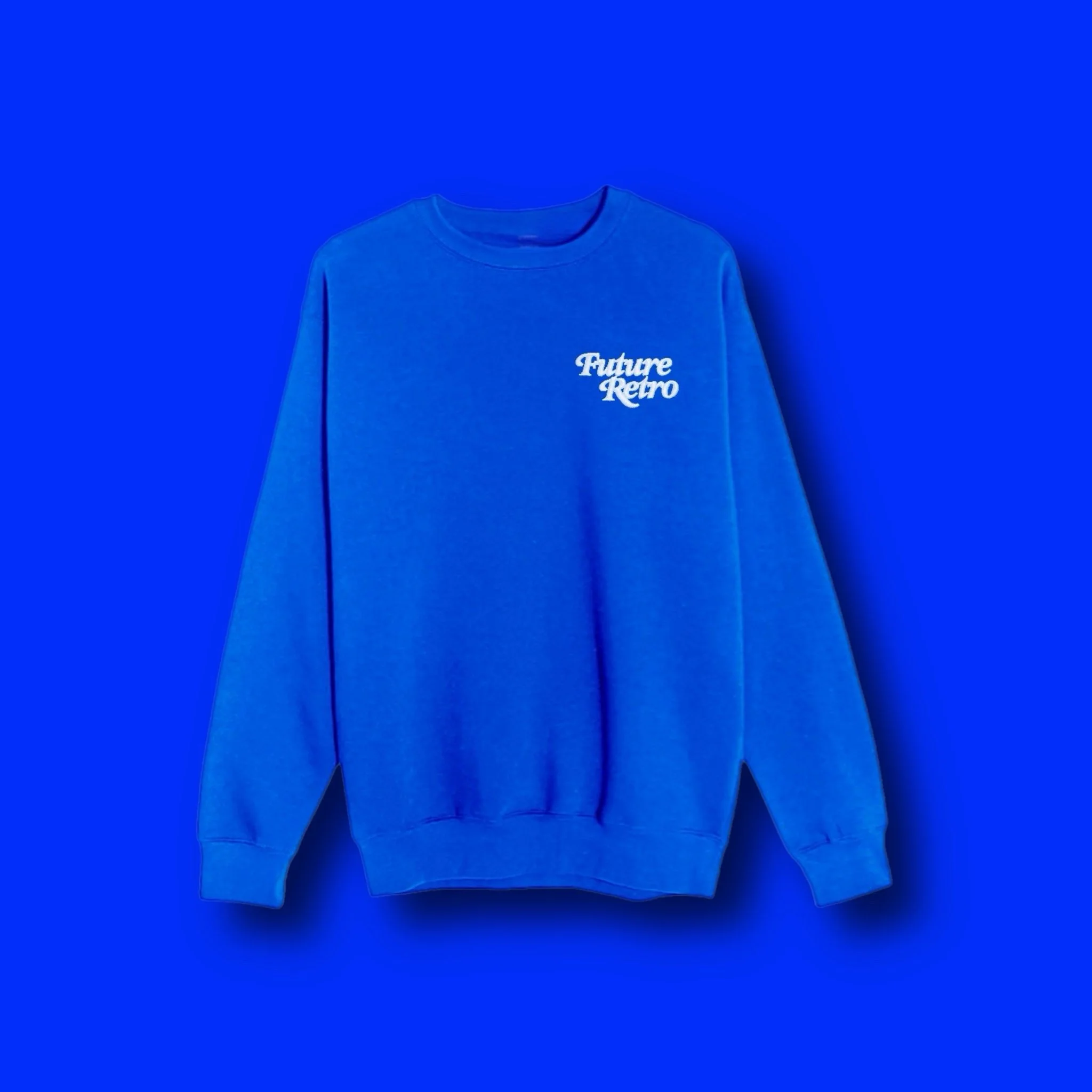 Blue sweatshirt with white embroidered text that reads 'Future Retro' on the upper left chest, against a matching blue background.