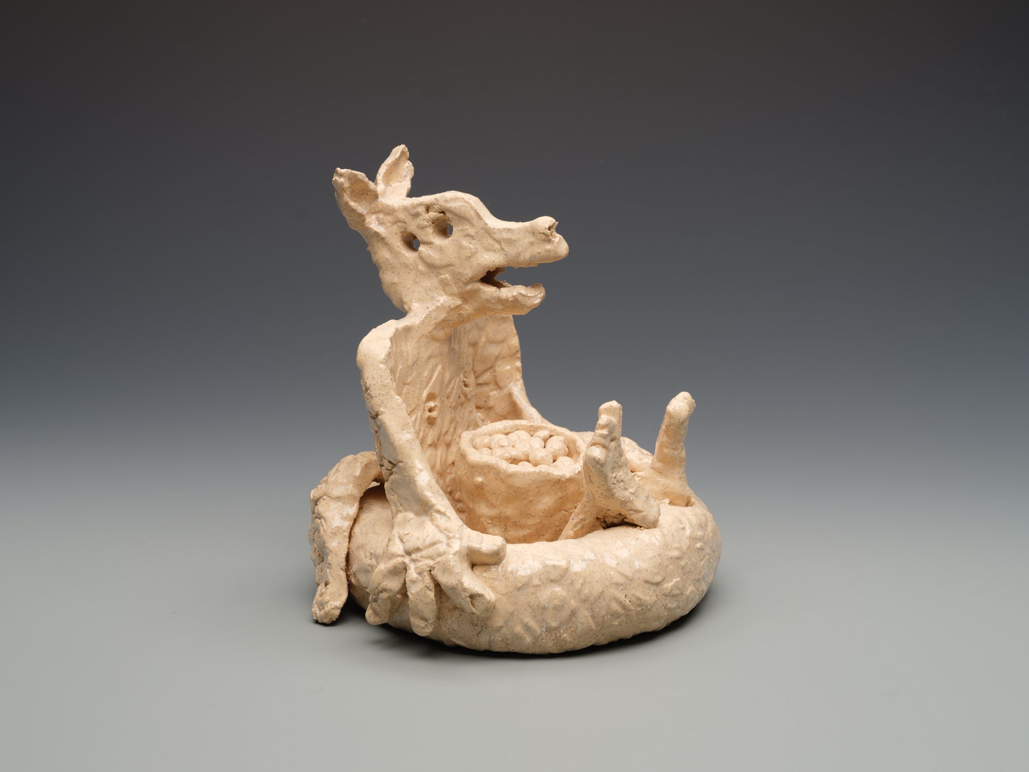 Canoe Journey: Coyote in Inner Tube, 2016, low fire ceramic, 6 ½ x 7 x 7 ½ in. (16.5 x 17.8 x 19.1 cm). Photograph by Dean Davis.
