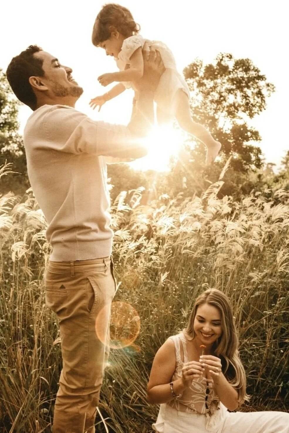 Dad, child and mom happy in nature and connected after family therapy at Family Solutions Counseling in Golden, Arvada, Lakewood CO