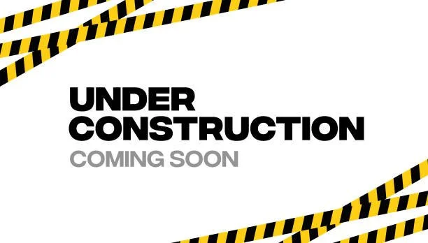 Sign with black and yellow construction tape border, reading 'Under Construction Coming Soon' in bold black and gray letters.