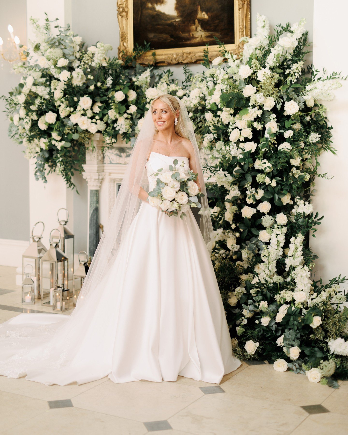 Elegant wedding inspo from Sam &amp; Jimi's day! A masterclass in crisp white decor, the floral installation over the fireplace was out of this world! For their guest book, they decided to have a phonebox audio guest book which was really memorable a