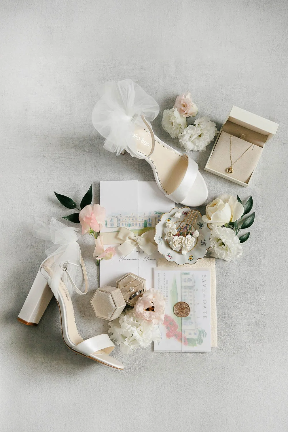 layflat photo of bridal details - accesories, invites, shoes, rings
