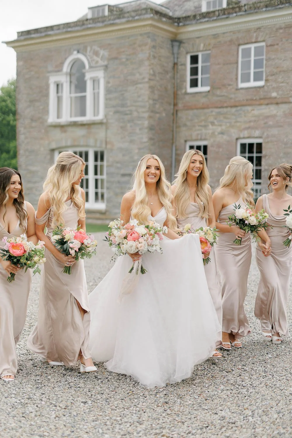 Bride and bridesmaids portraits in front of the iconic Boconnoc Estate