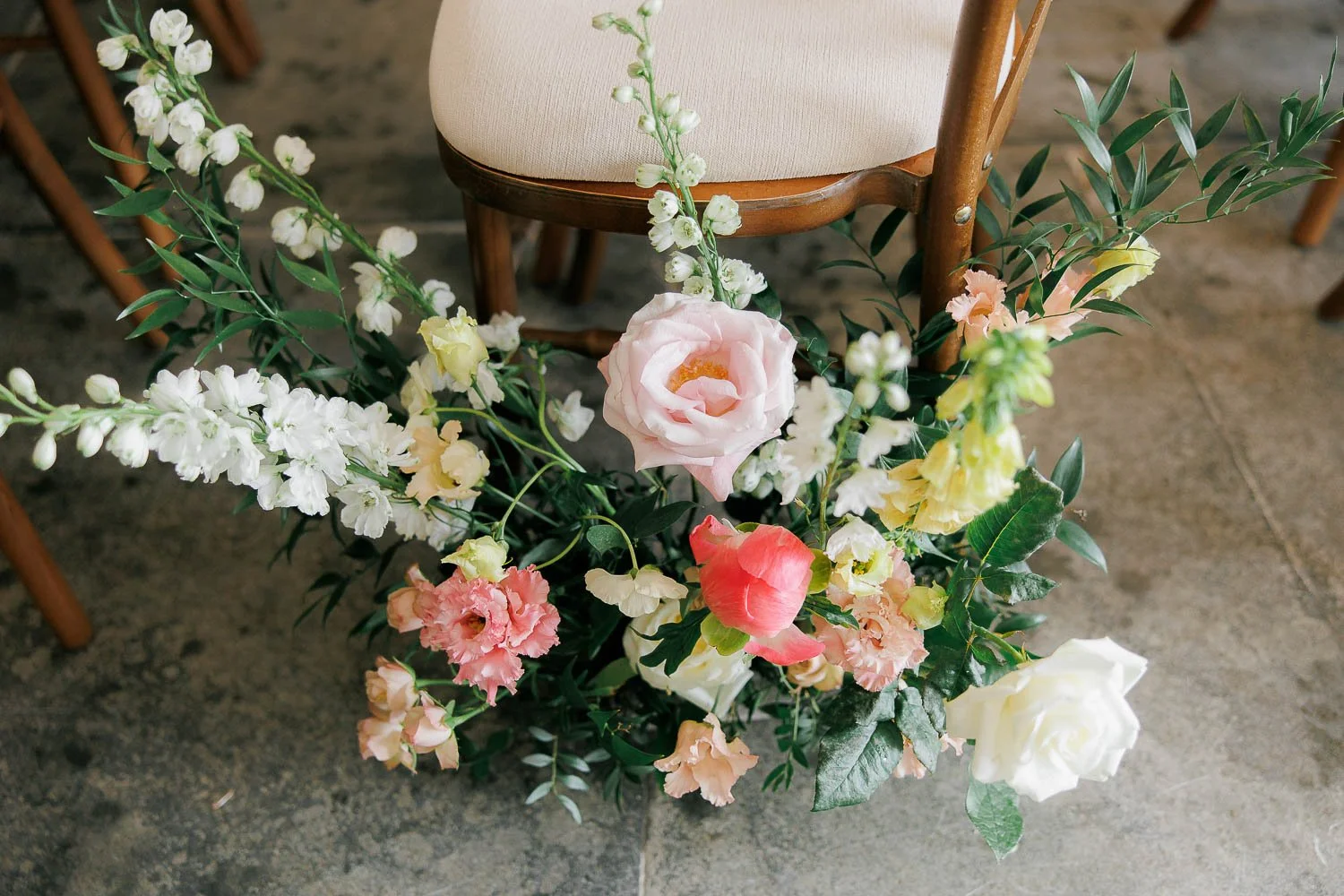 aisle florals detail photo, colourful flowers