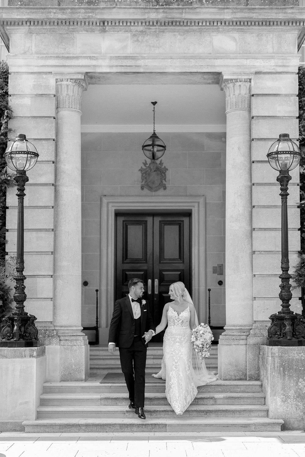 Couple portraits on steps of Hedsor