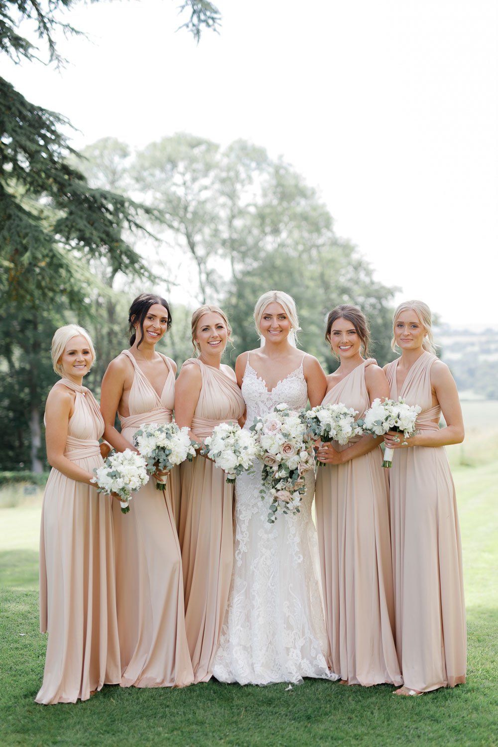 bridesmaids in pastel pinks at hedsor house