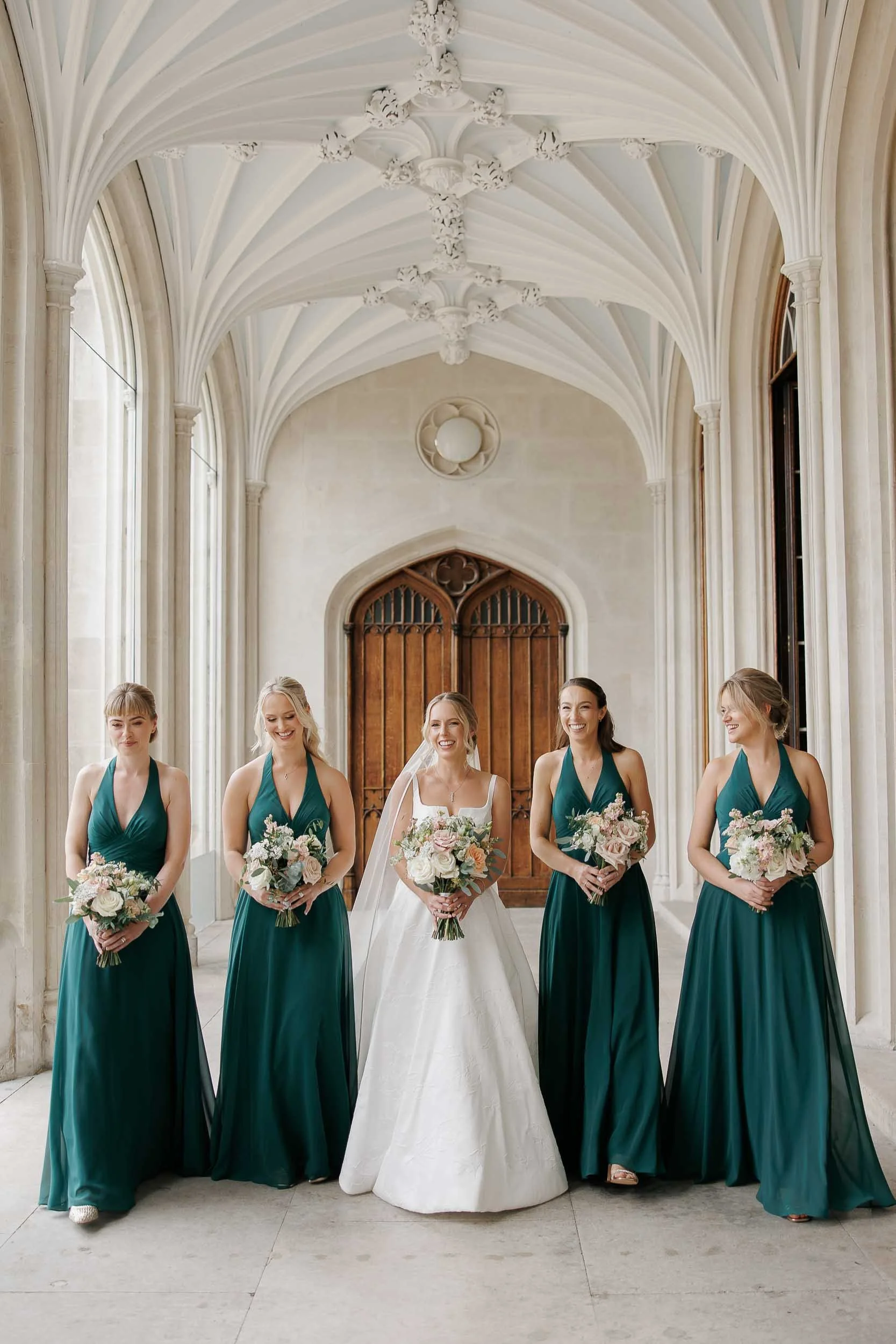 Bride & bridesmaids in the indoor corridors of Ashridge House, Hertfordshire
