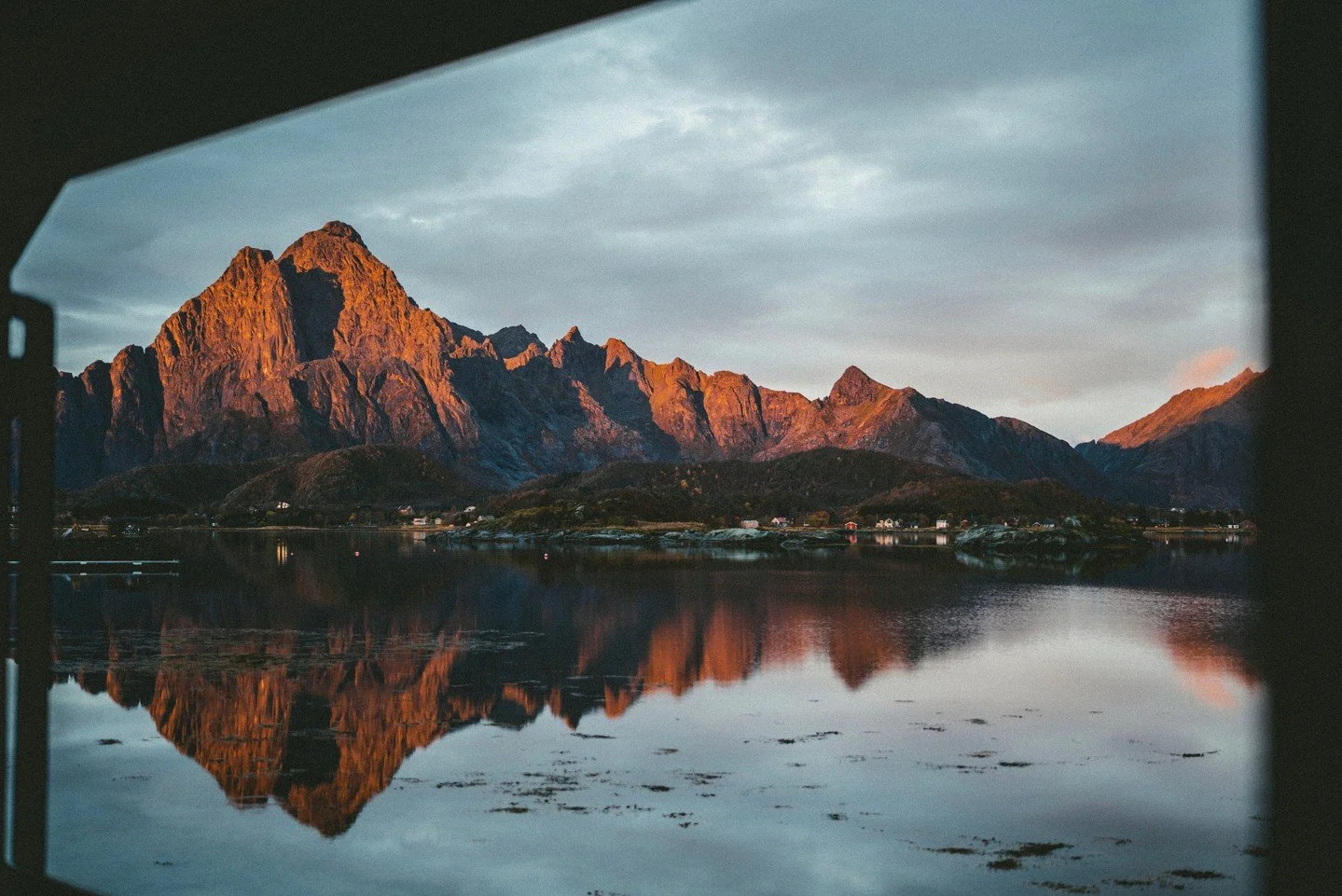 This is the view from our waterfront cabins &mdash; V&aring;gakallen glowing in the afternoon light, right across the fjord.⁠
⁠
No filter needed. Just Lofoten doing its thing.