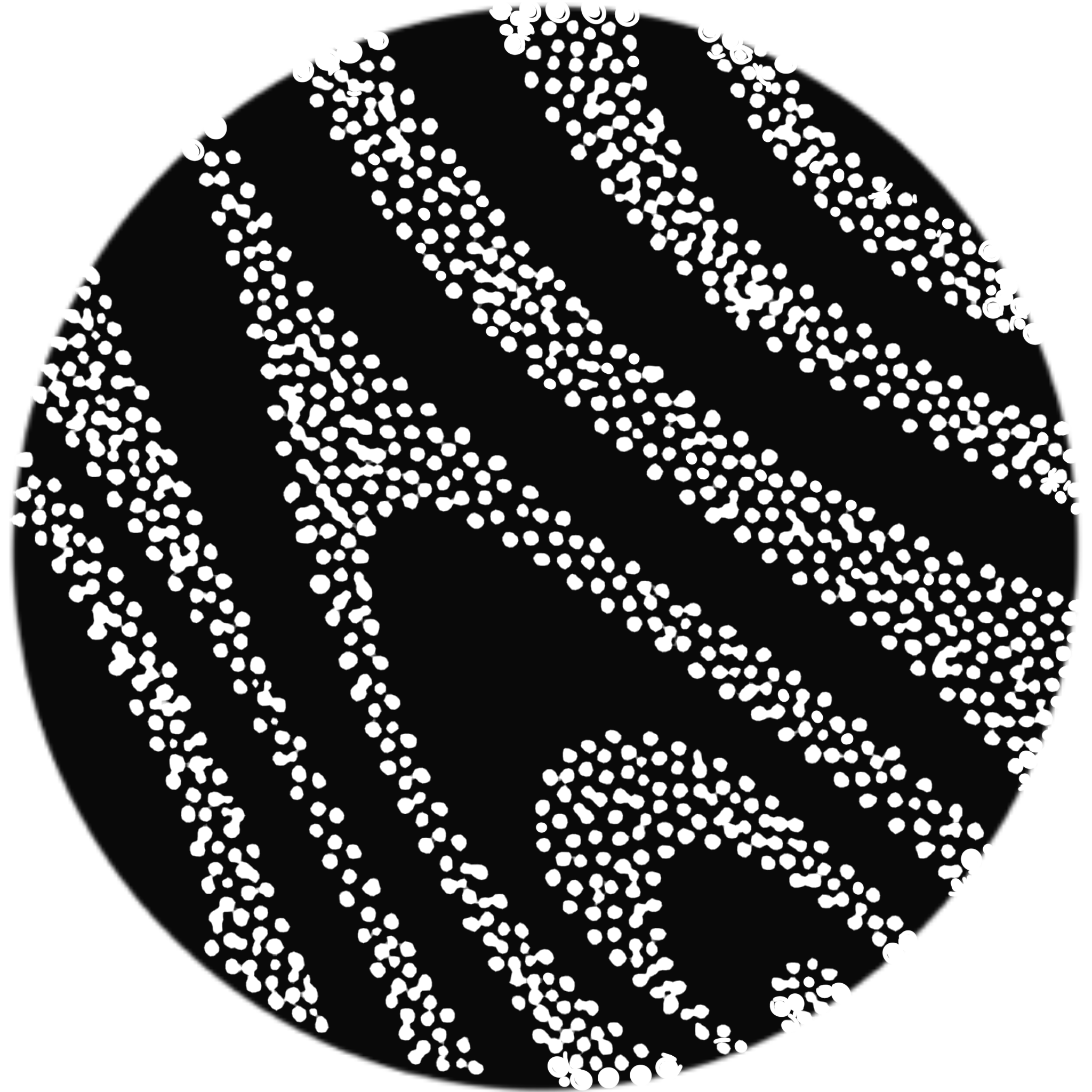 Close-up of a black and white printed tennis ball with distinct pattern and texture.