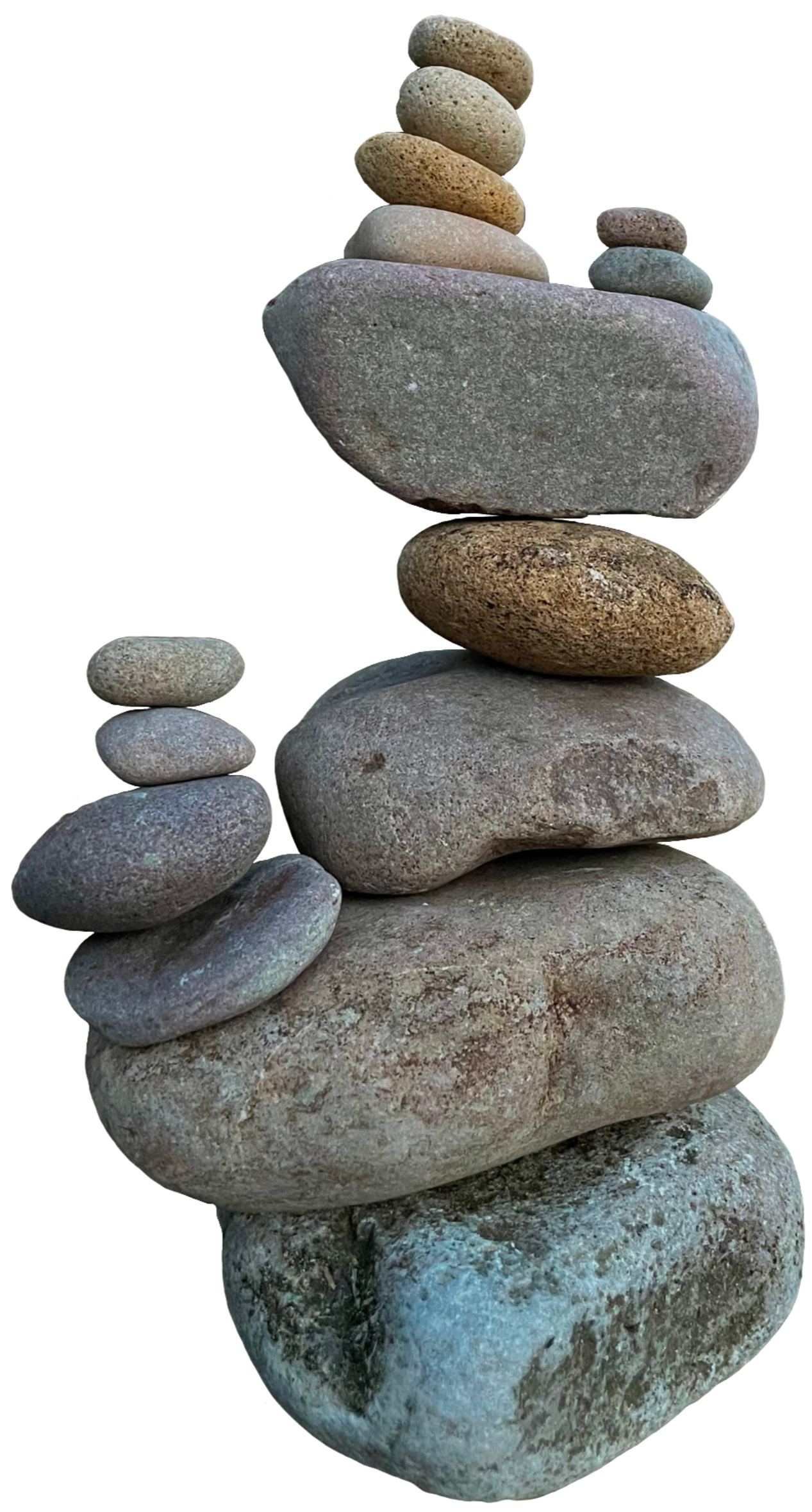 Stacked array of various sized and colored smooth stones.