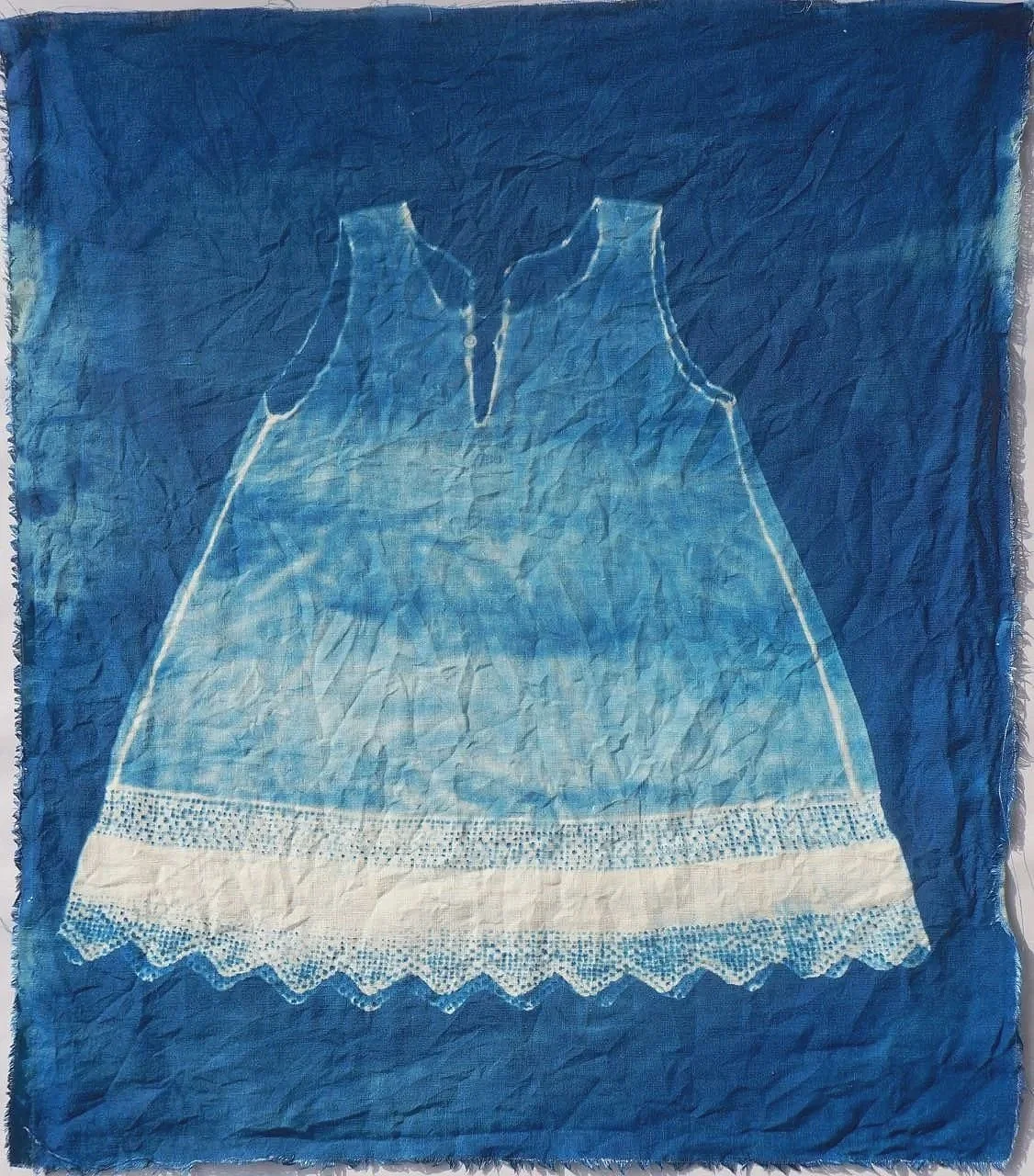 cyanotype of child's smock on linen