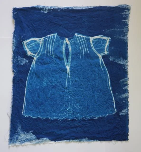 cyanotype of child's dress on linen