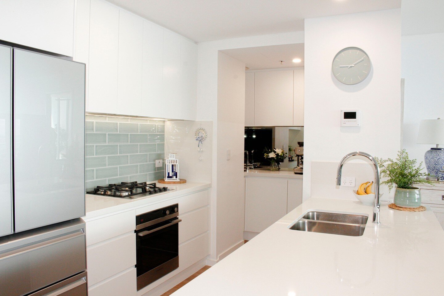 Here's another view of the kitchen in our Gold Coast apartment.  The existing kitchen had a breakfast bar upstand which made the whole space feel closed in and cramped.  Removing this and making the bench wider has made the whole kitchen feel so much