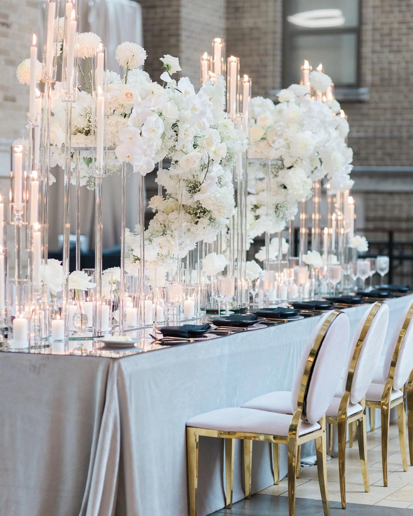 Crystal candelabras, acrylic, mirror tabletop, velvet and all white blooms. Just put me out of my misery! I can&rsquo;t take it; it&rsquo;s so freakin good! 
.
.
.
#eventdesign #ohioflorist #fyp #columbusflorist #wedding #luxurywedding #premadesigns 