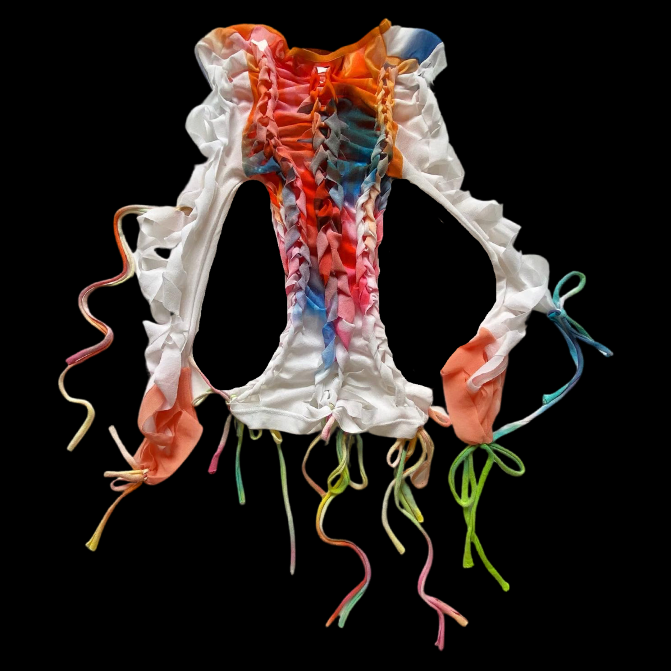Colorful, ruffled fabric piece with ties, set against black background.