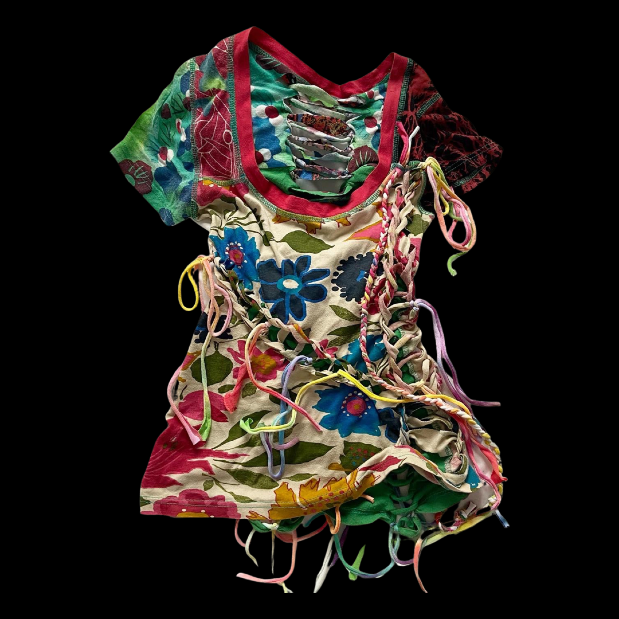 Colorful, floral patterned dress with multicolored ribbons and laces on a black background.