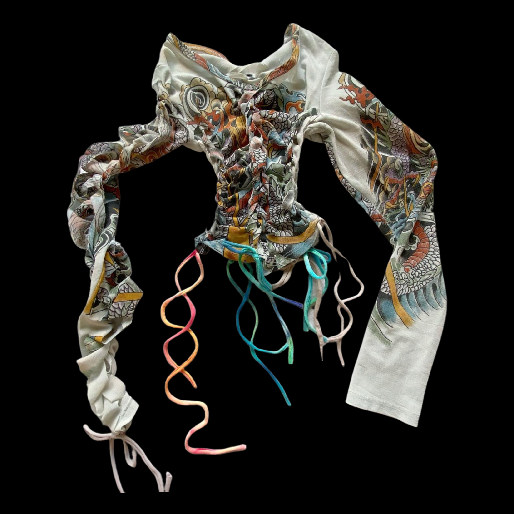 A long-sleeved, cream-colored shirt with a colorful dragon and floral design, tied at the waist with multicolored shoelaces against a black background.