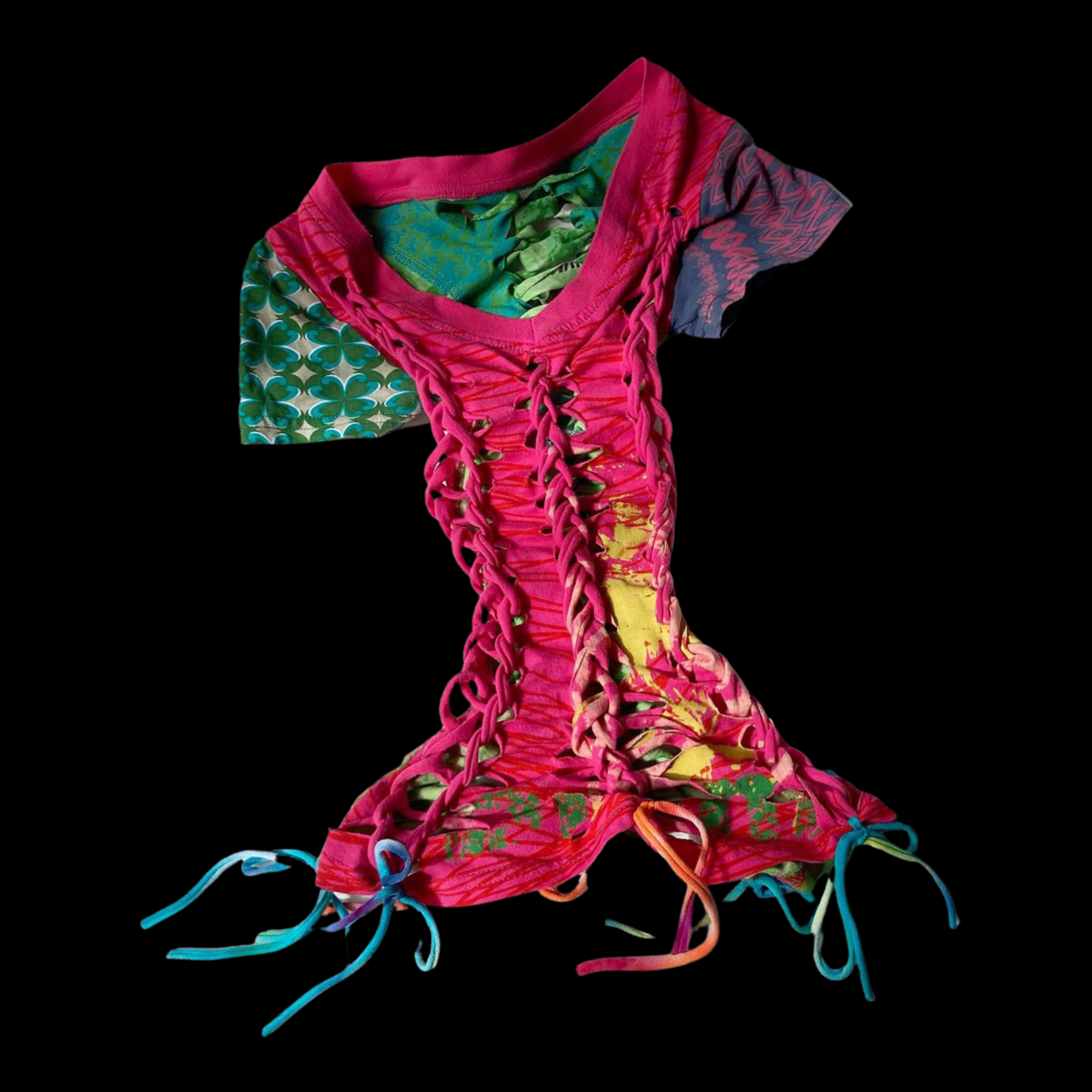 Colorful, fashion-forward top with lace-up front and mixed-pattern fabric in pink, green, yellow, and blue, against a black background.
