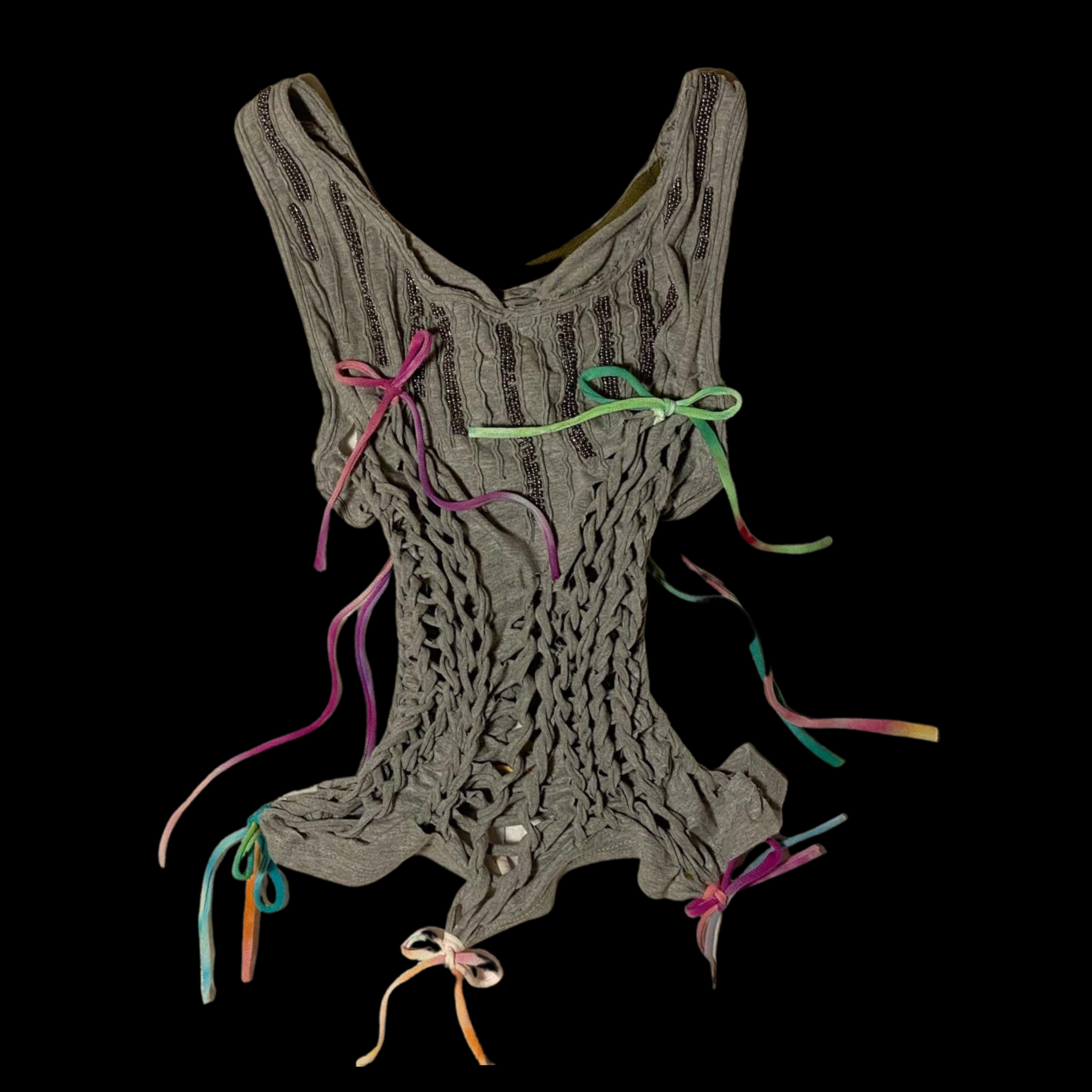 A gray knitted garment with colorful ribbon ties, displayed against a black background.