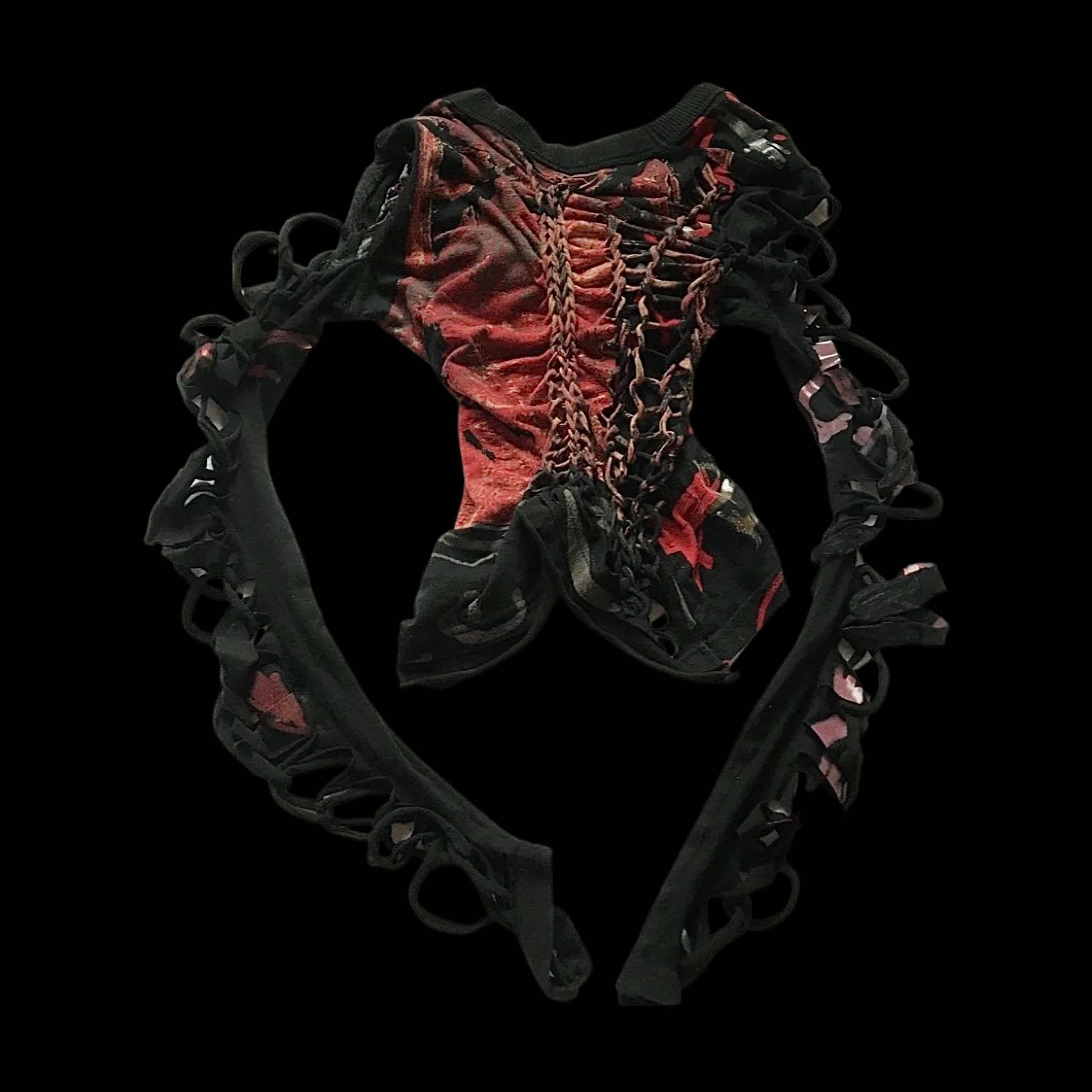 Black and red patterned clothing with intricate lacing and cut-out details, laid flat against a black background.