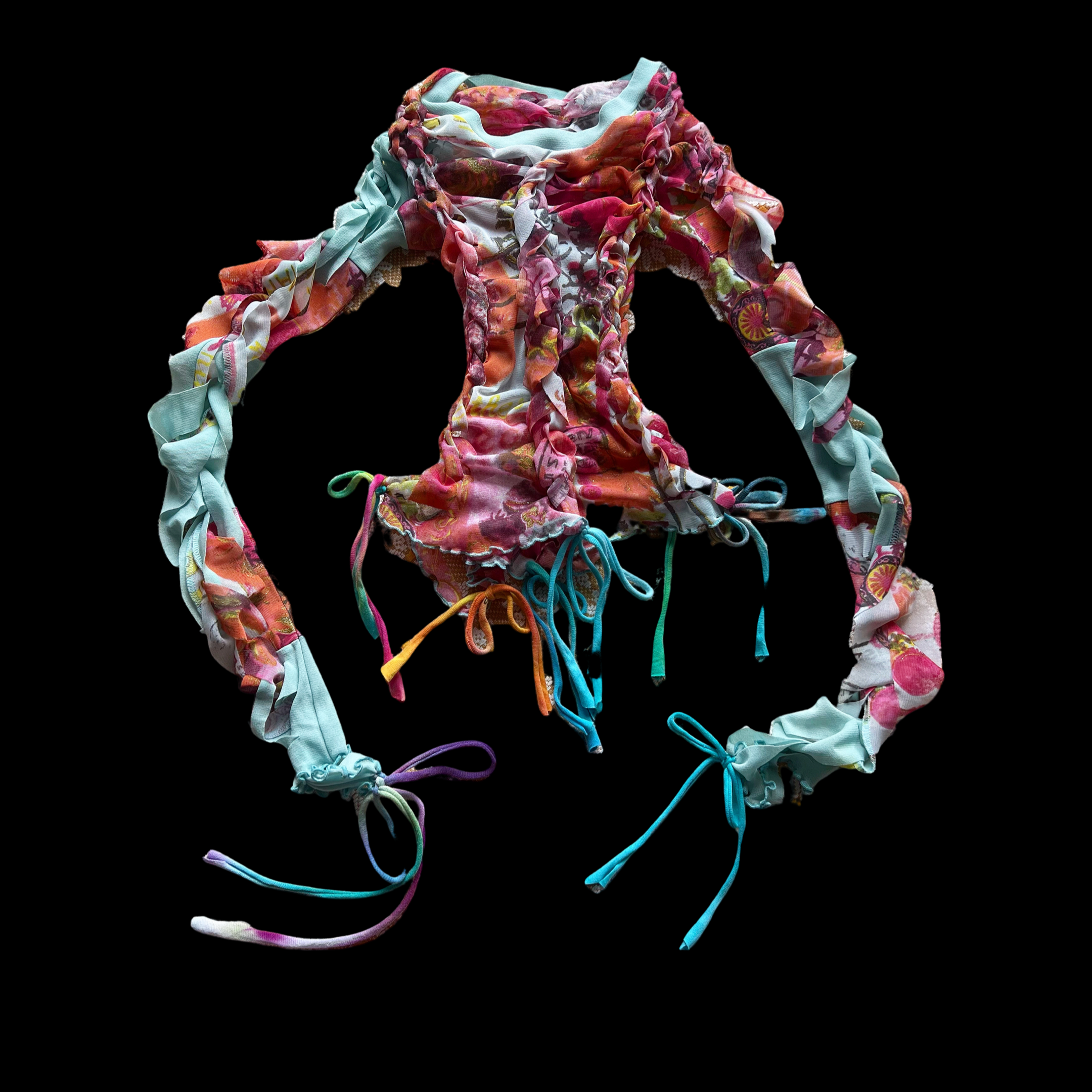 A collection of colorful, tied, and twisted fabric headbands with floral and abstract patterns, arranged in a circular shape on a black background.