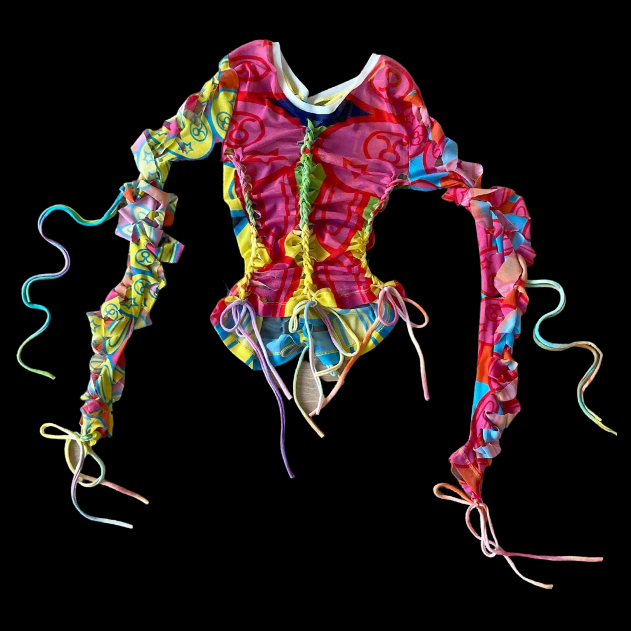 Colorful, ruffled, and tie-dyed top with multicolored ribbons against a black background.