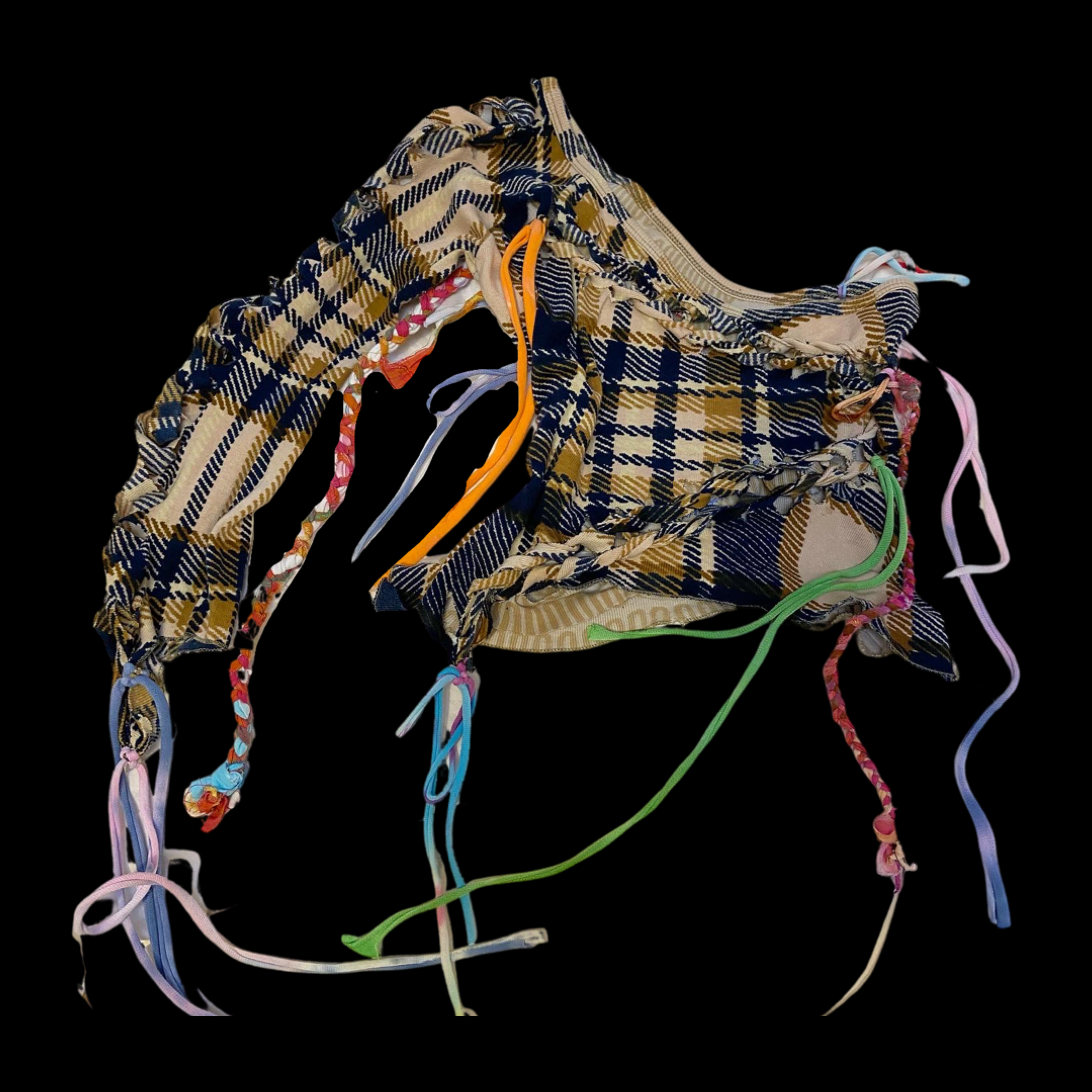 A drawstring bag with a beige, blue, and brown checkered pattern, adorned with multicolored fabric and ribbon ties.