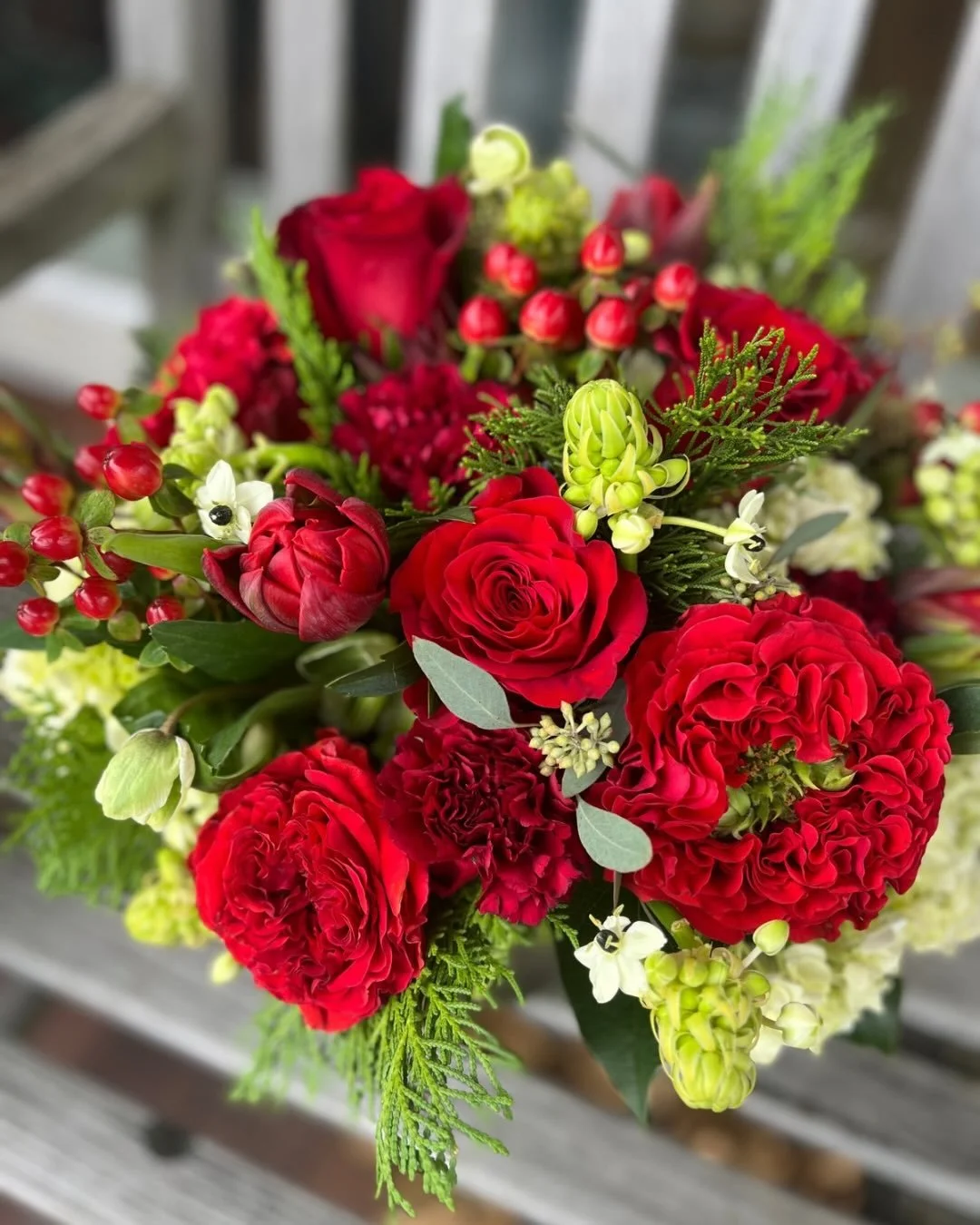 Need a festive centerpiece for your upcoming gathering? We got you covered! 

This beauty was designed with fresh tulips, roses, hypericum berry, a star of Bethlehem variety, green hydrangea, and accents of eucalyptus and winter cypress. 

#holidayce