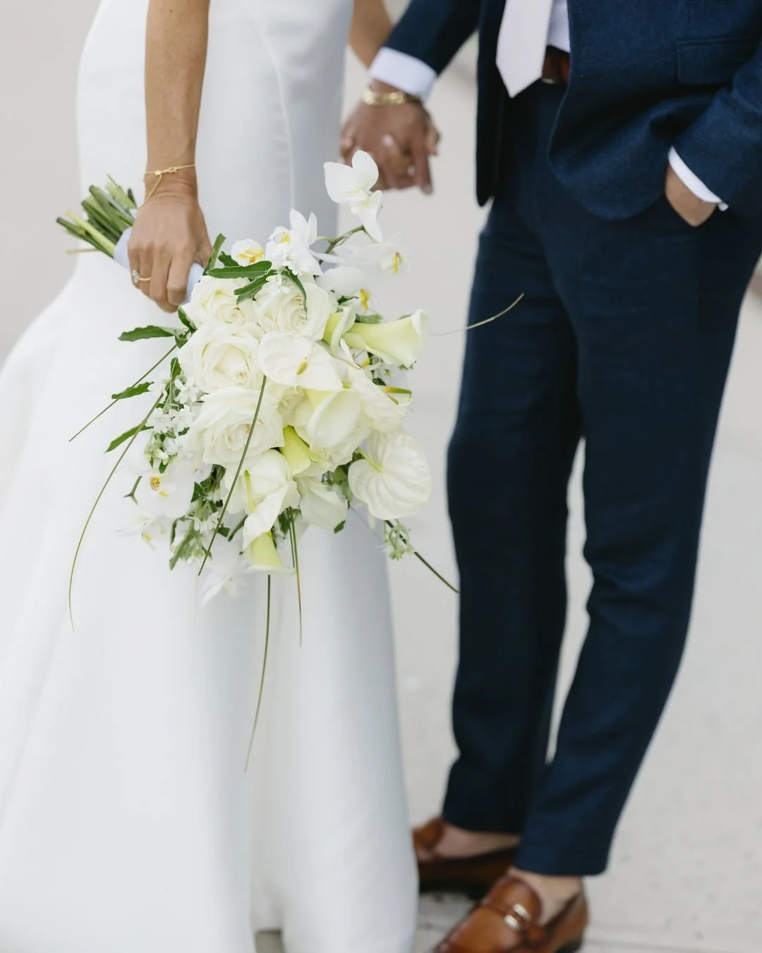 Our bride Randi was absolutely glowing on her wedding day. Her bouquet was sophisticated, modern, and effortless just like her; tropical orchids and anthuriums paired with roses, tweedia, and cala lilies. We kept the bridal party simple and elegant w
