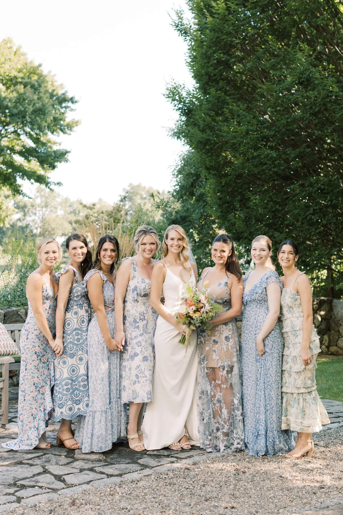 Bridesmaids in light blue standing around the bride.jpg