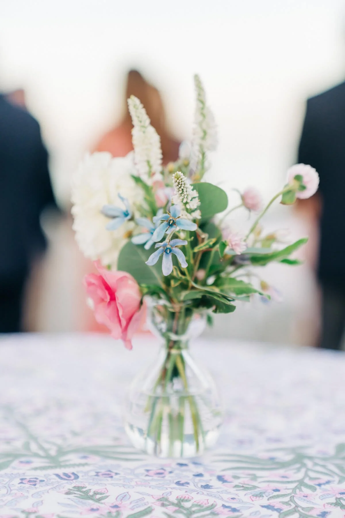 Single small bud vase with wedding flowers.jpg