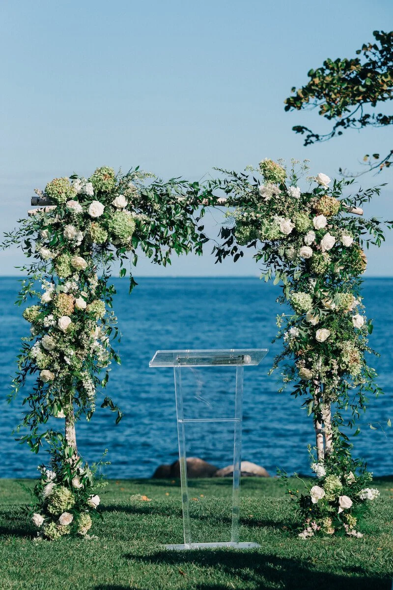 Large outdoor arbor decorated with flowers.jpg