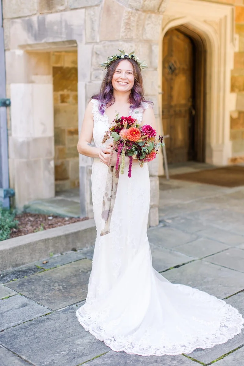Bride smiling and holding her bouquet.jpg
