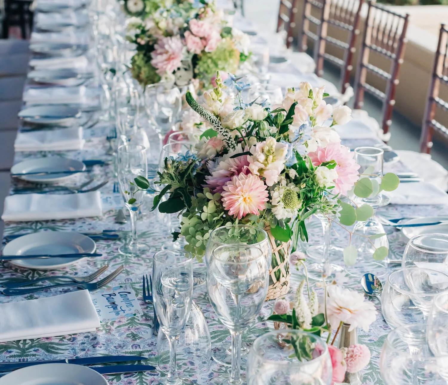 Floral designs on a long wedding banquet table (1).jpg