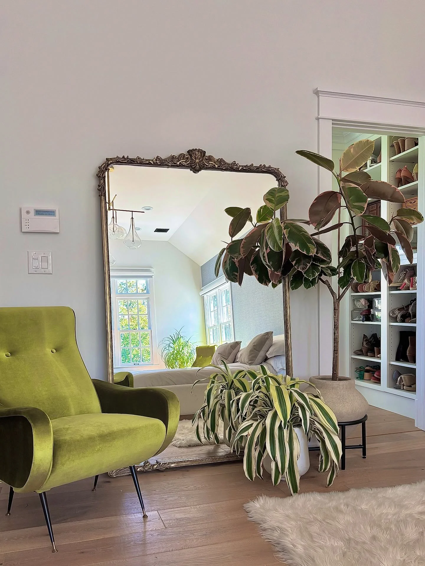 Who said adding houseplants meant limiting yourself to shades of green?

This primary bedroom&rsquo;s seating area let BB get creative with colors and patterns to play off this bold, standout chair without distracting from it.

Botanically Blurred cu