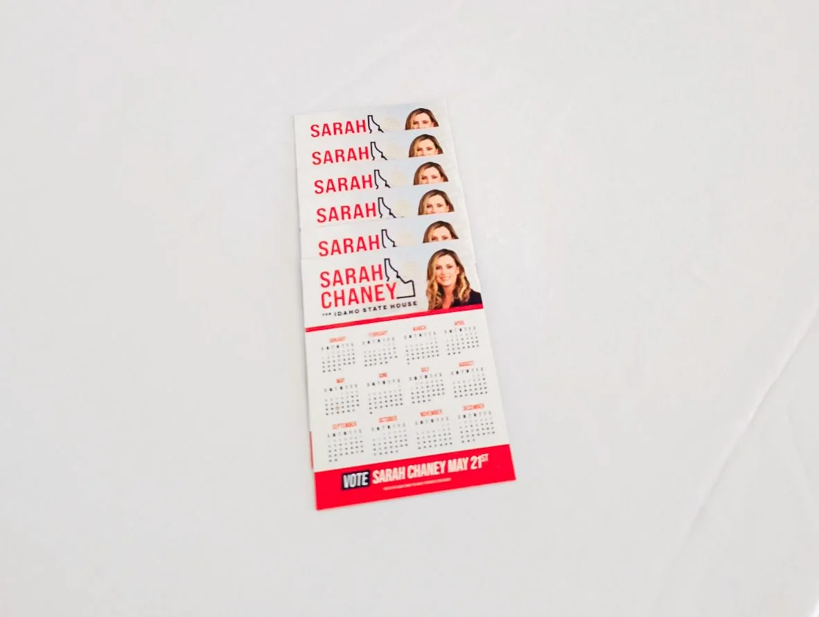 A political campaign calendar with a photograph of Sarah Chaney, featuring her name multiple times and a voting message at the bottom indicating her election date as May 2nd.