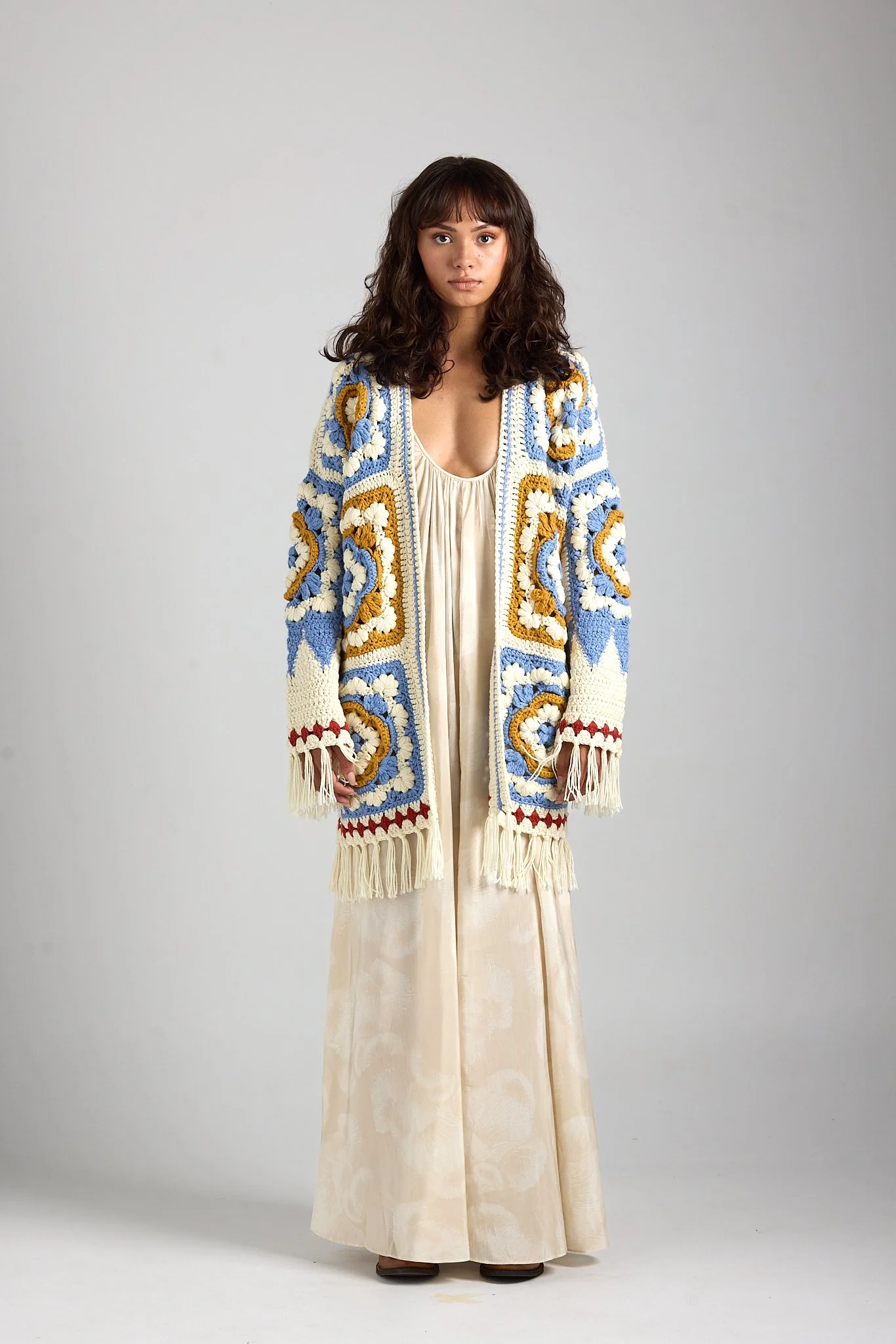 Fashion and beauty inspired image for First Born Knit, captured in a minimal studio setting