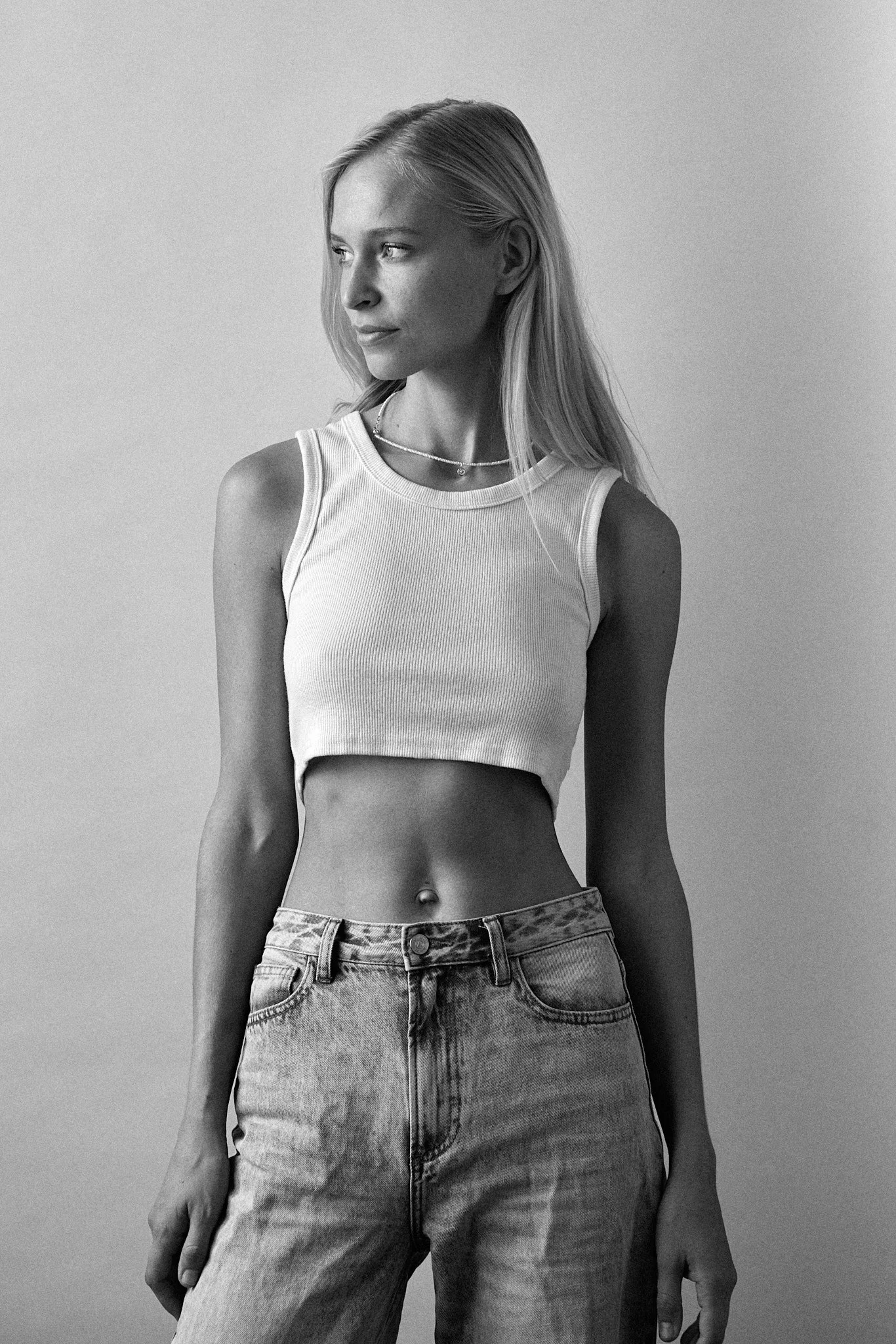 Simple studio portrait from a model test shoot with clean natural styling.