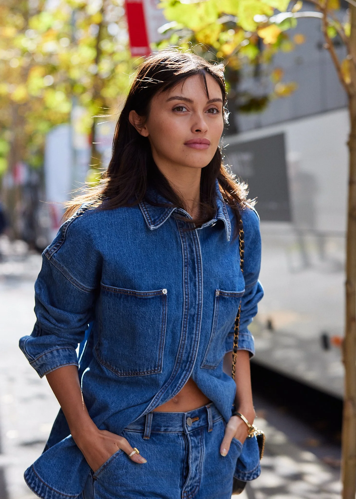 Street fashion portrait of a woman in denim photographed outdoors with natural light.