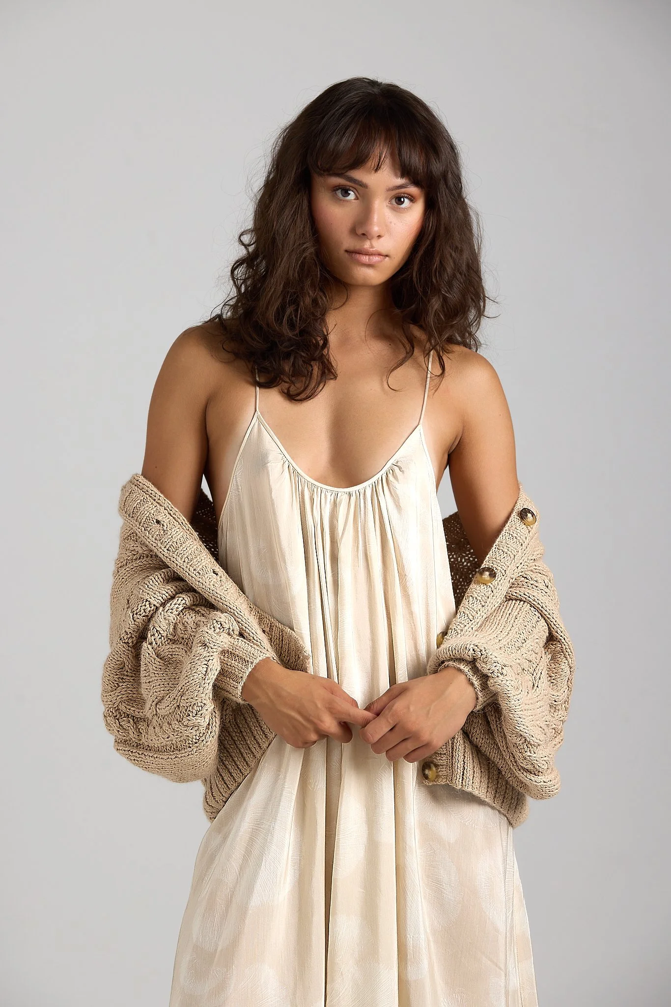 Editorial fashion shot featuring First Born Knit knitwear on model in studio