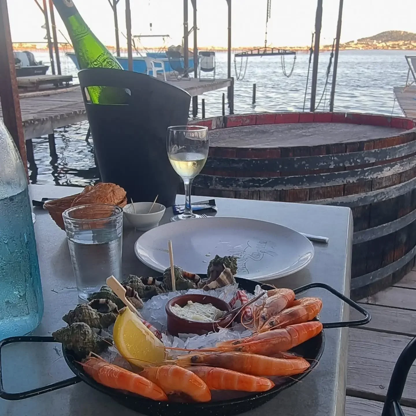 Great discoverey in Bouzigues, down by the boats on wooden platform above the water - @benvenuthau. Mixture of fresh and grilled shellfish. #bouzigues #seafood #grilledoysters #grilledmussels