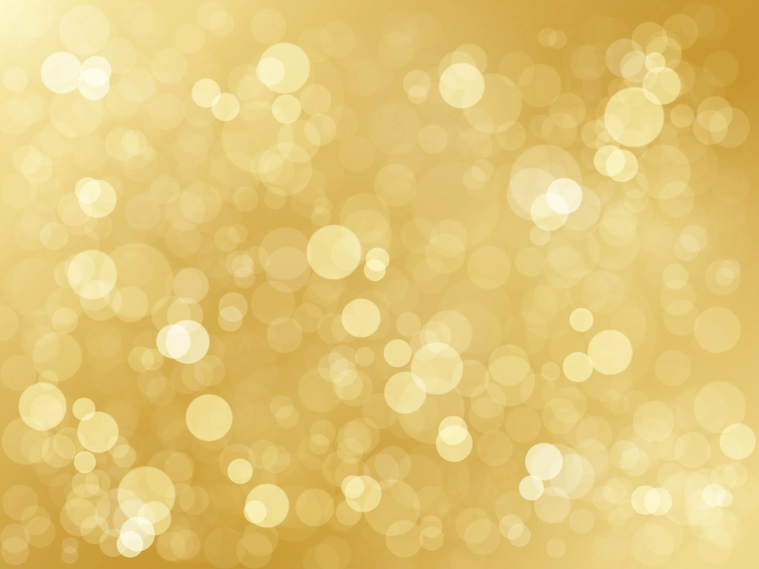 Gold bokeh lights background with soft circular light patterns.