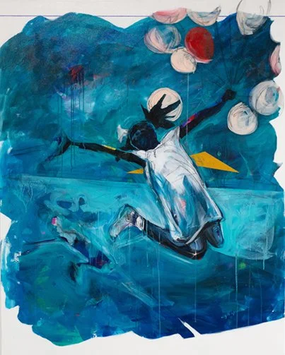 A young girl jumping with her arms spread, on a moody blue background.