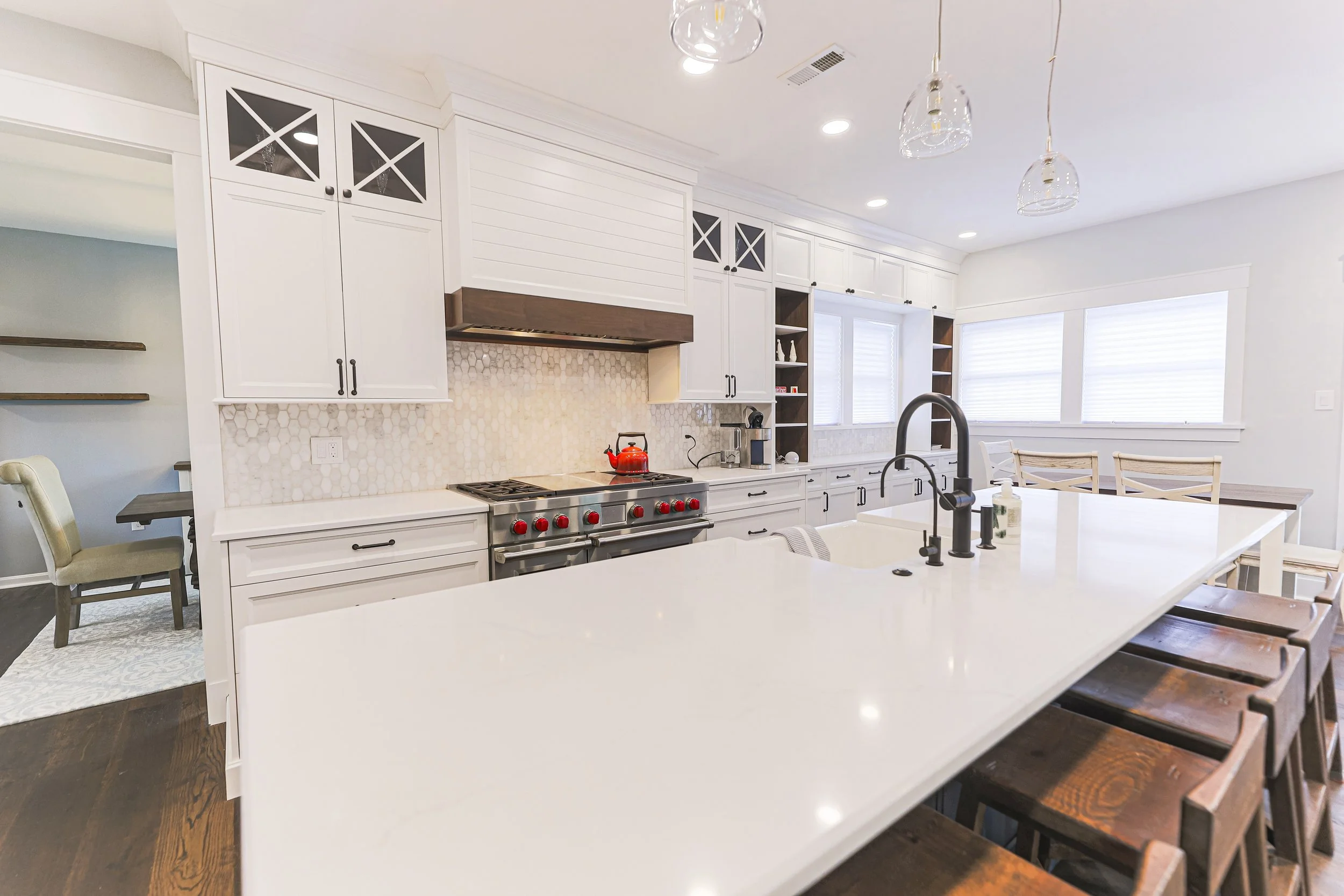Quartz kitchen island with counter seating in a Doylestown first-floor renovation