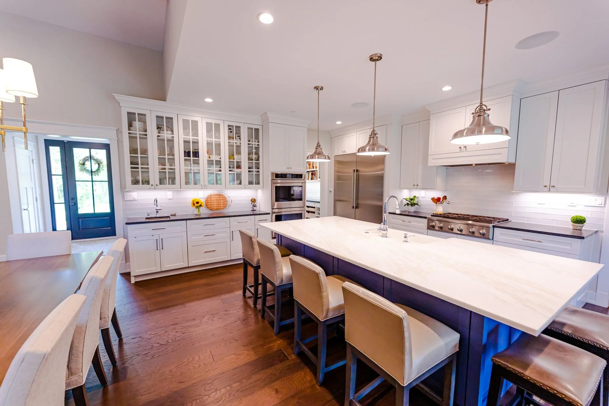 Doylestown custom home kitchen with navy island and white cabinets