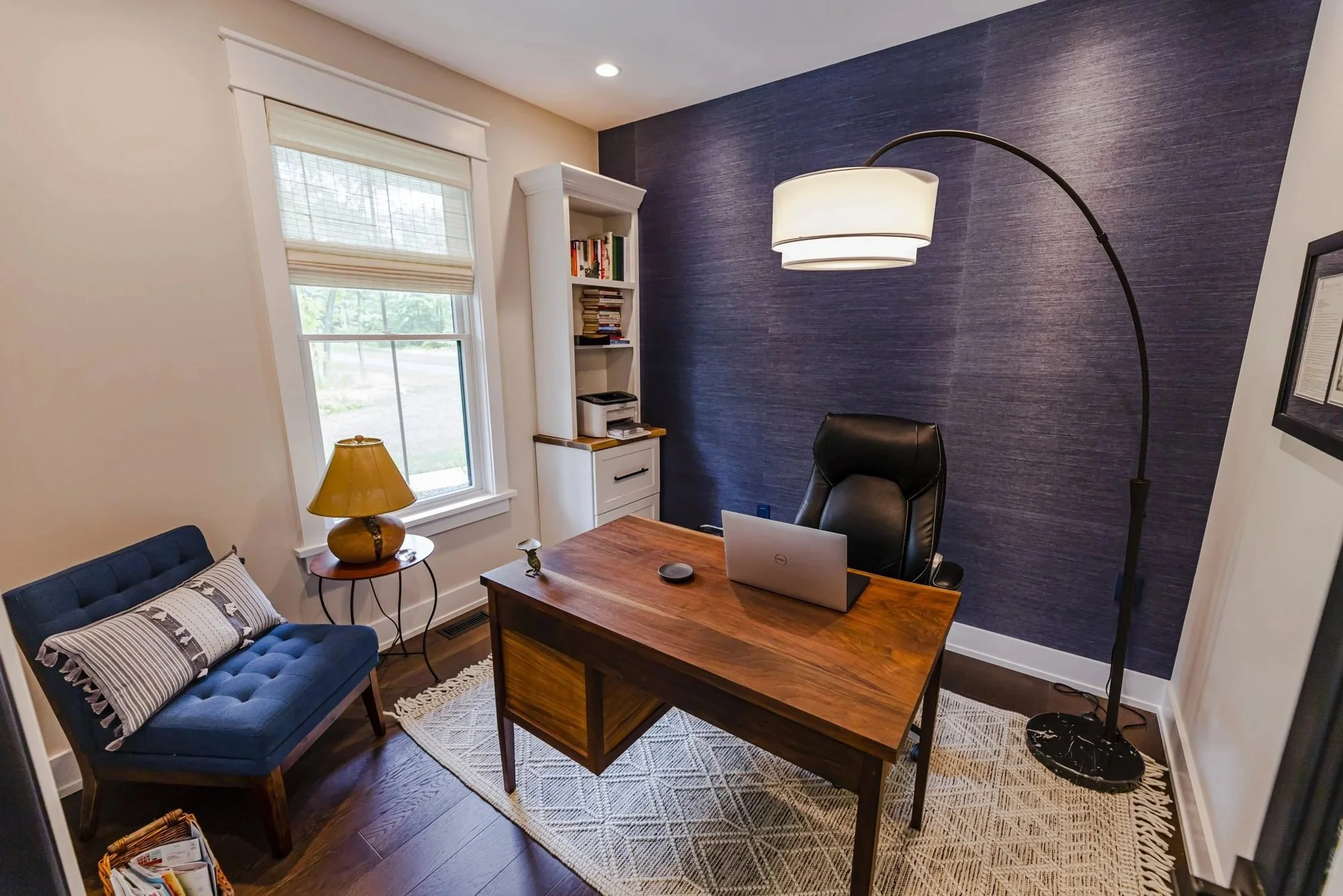 Home office with navy accent wall in a Doylestown custom home
