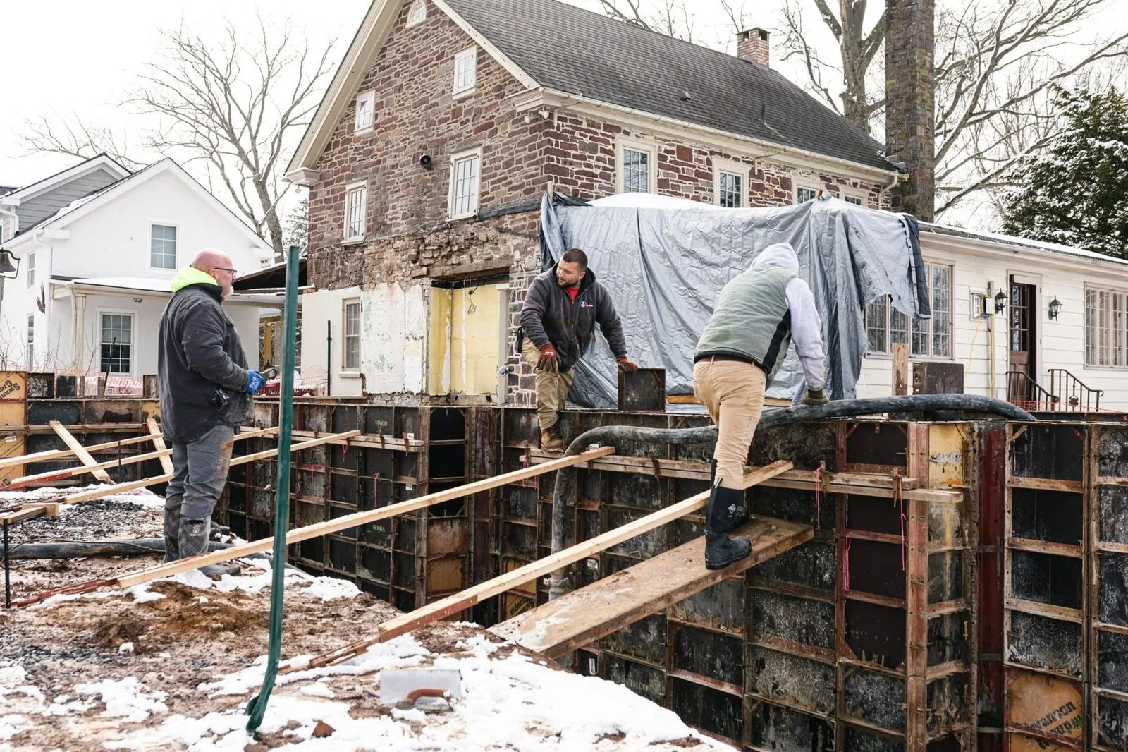 Winter foundation pour for a stone farmhouse addition in Bucks County