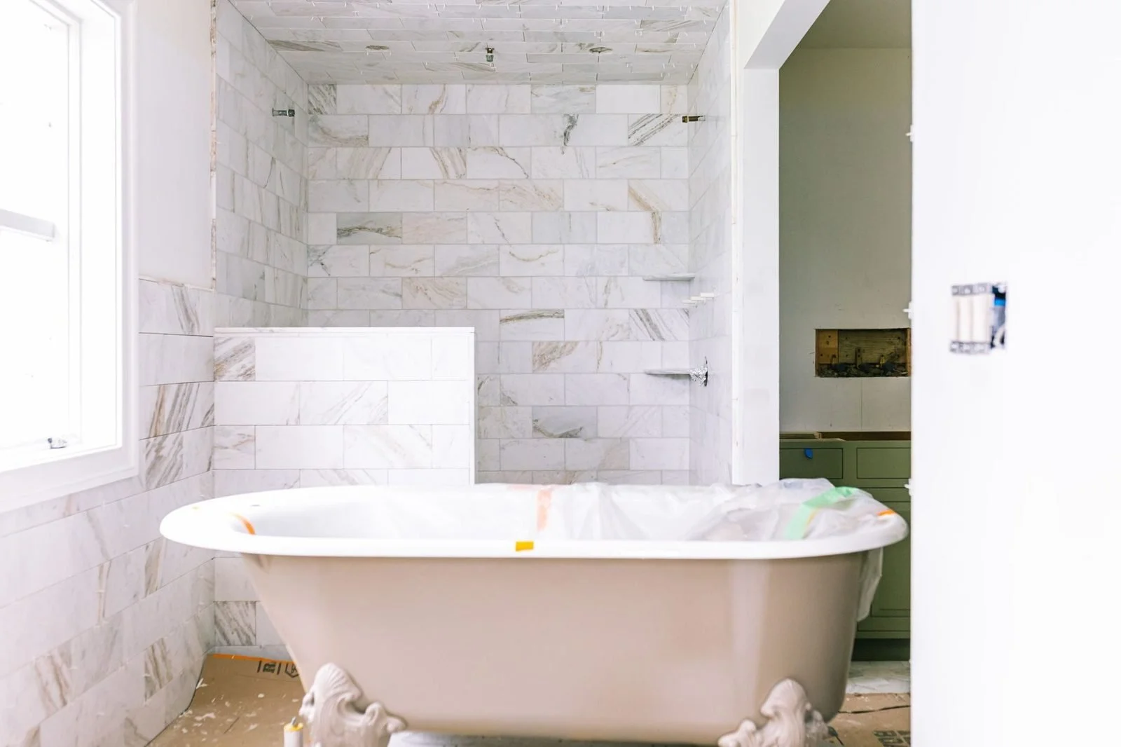 Marble bathroom with freestanding tub in a Bucks County home
