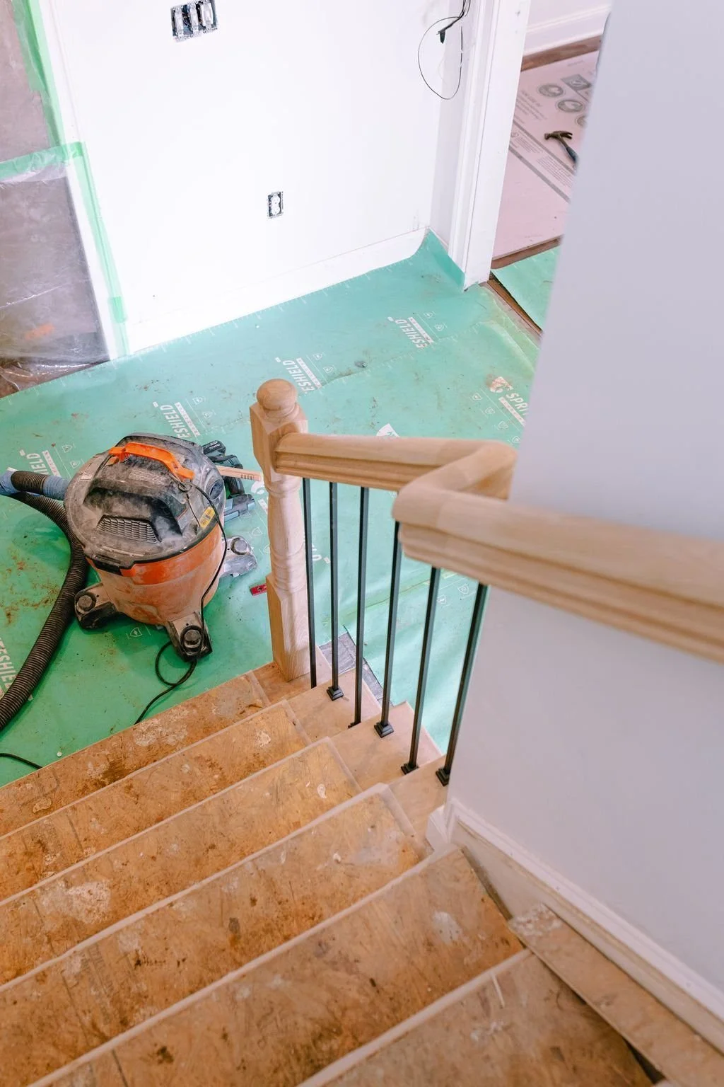 Stained stair railing in a Bucks County cottage addition